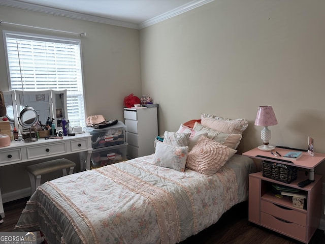 bedroom with crown molding and dark wood-type flooring