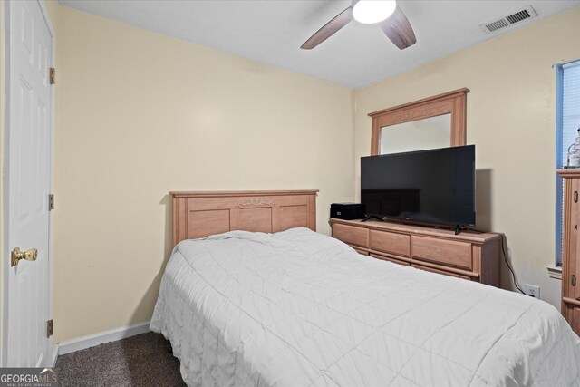 bedroom with ceiling fan and carpet floors