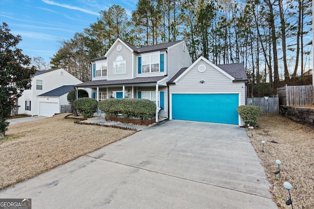 front of property featuring a garage and a front yard