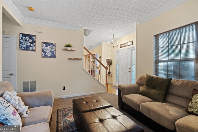 living room with crown molding, carpet flooring, a chandelier, and a textured ceiling