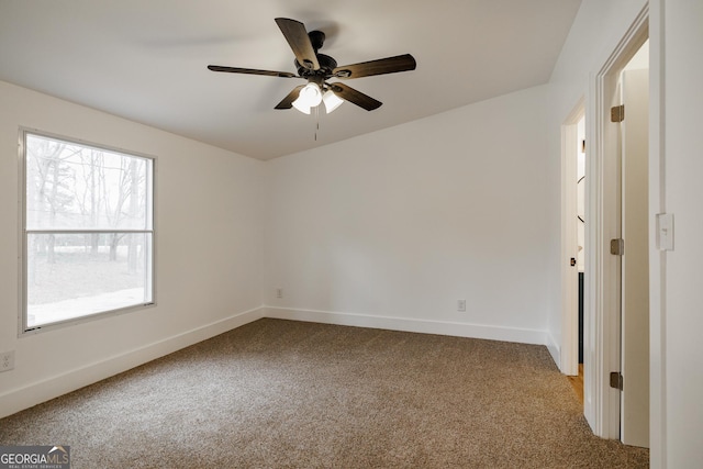 carpeted empty room with ceiling fan