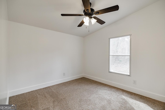 unfurnished room with lofted ceiling, ceiling fan, and carpet