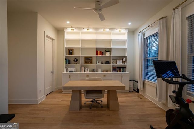 home office featuring ceiling fan and light wood-type flooring