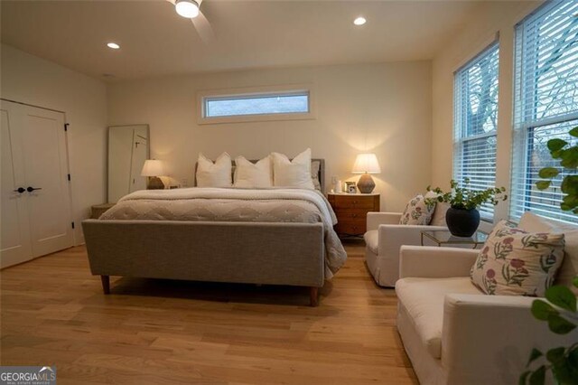 bedroom featuring light hardwood / wood-style flooring and ceiling fan