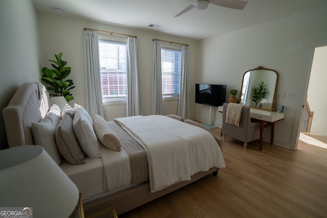 bedroom featuring ceiling fan and light hardwood / wood-style flooring