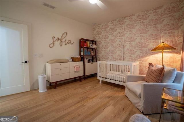 bedroom with hardwood / wood-style floors and ceiling fan