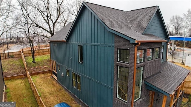 view of property exterior featuring a lawn