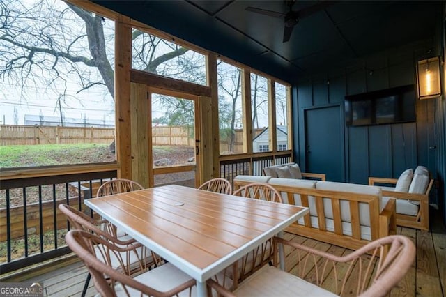 sunroom / solarium with ceiling fan