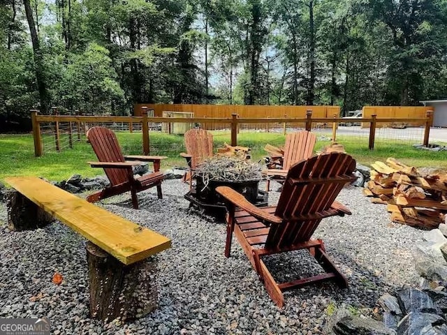 exterior space with fence and an outdoor fire pit