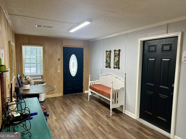 bedroom featuring crown molding and wood-type flooring