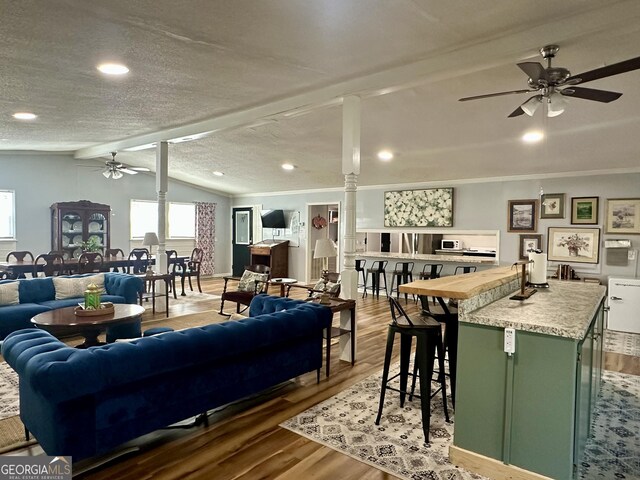 living area featuring hardwood / wood-style floors and a fireplace