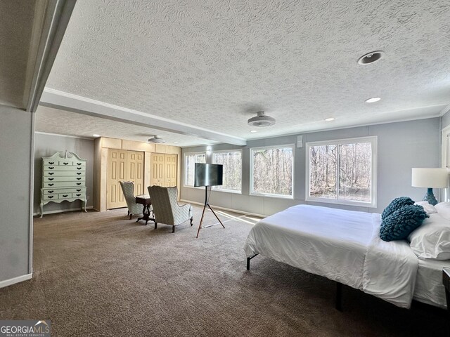 bedroom with a fireplace and carpet flooring