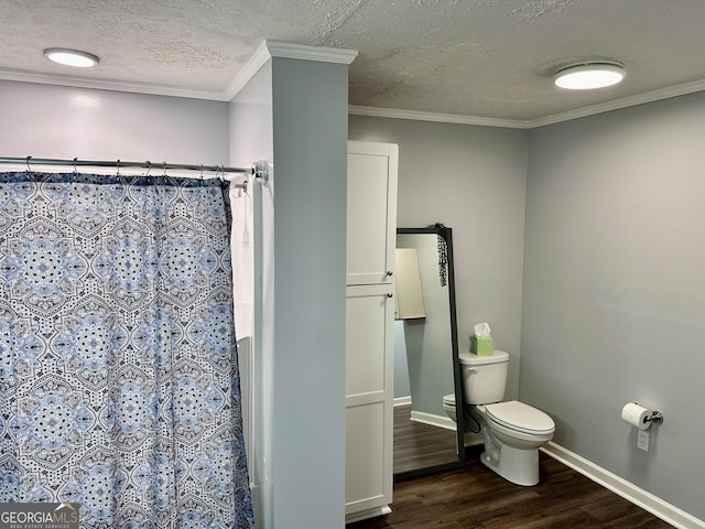 bathroom featuring wood-type flooring, toilet, crown molding, a textured ceiling, and a shower with curtain