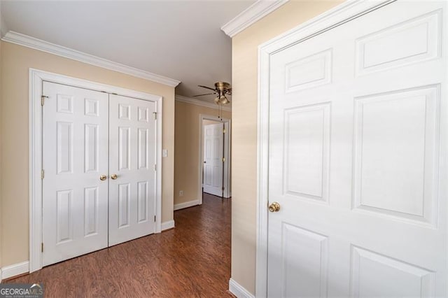 hallway featuring dark hardwood / wood-style flooring and ornamental molding