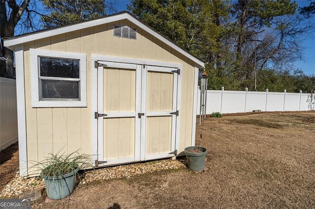 view of outdoor structure featuring a yard