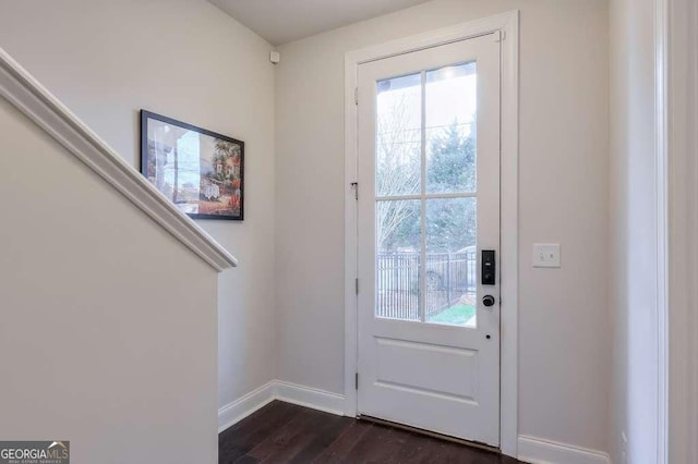 doorway to outside with dark hardwood / wood-style floors