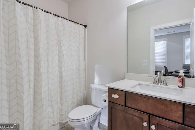 bathroom with vanity and toilet