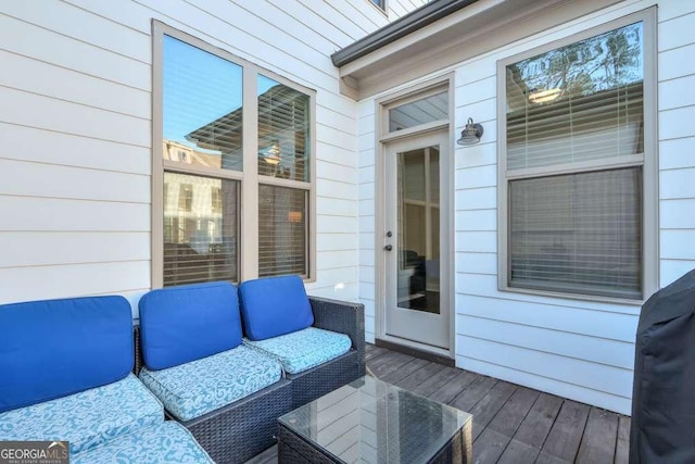 deck with an outdoor hangout area