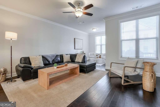 living room featuring crown molding, wood-type flooring, and ceiling fan