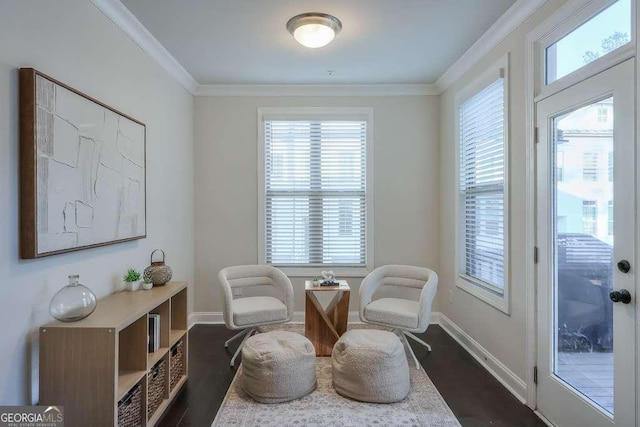 living area featuring ornamental molding and dark hardwood / wood-style flooring