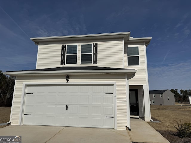 view of front of home with a garage