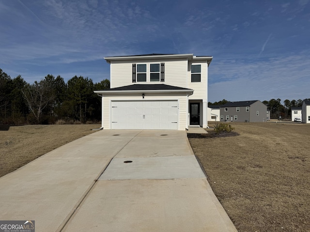 view of front property featuring a garage and a front lawn