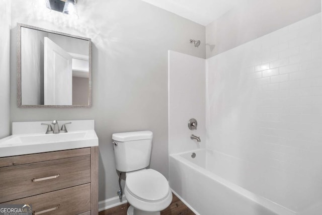 full bathroom featuring bathtub / shower combination, vanity, toilet, and wood-type flooring