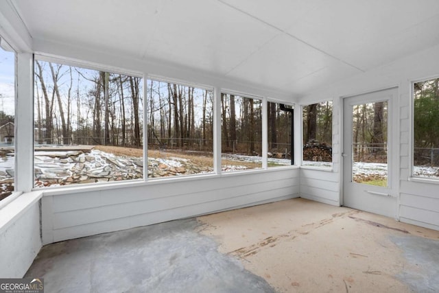 unfurnished sunroom with lofted ceiling