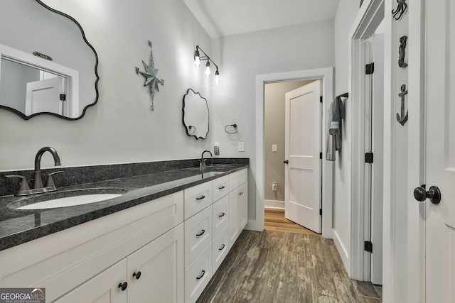 bathroom featuring hardwood / wood-style flooring and vanity