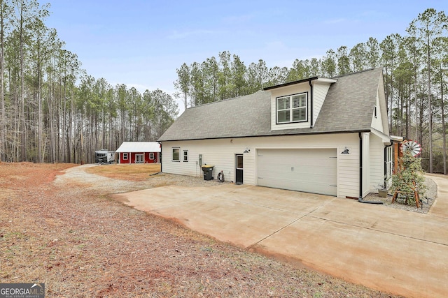 view of property exterior featuring a garage