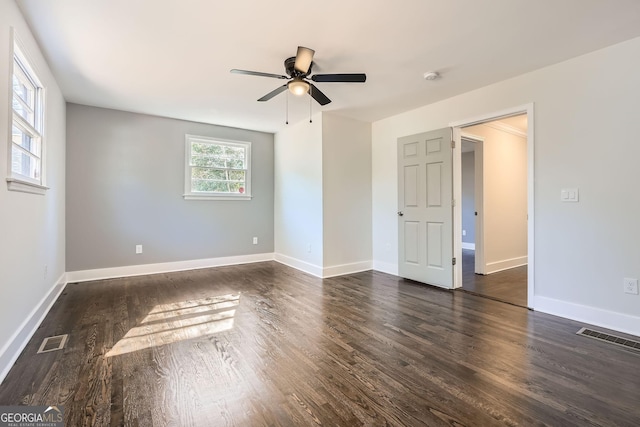 unfurnished room featuring dark hardwood / wood-style floors and ceiling fan