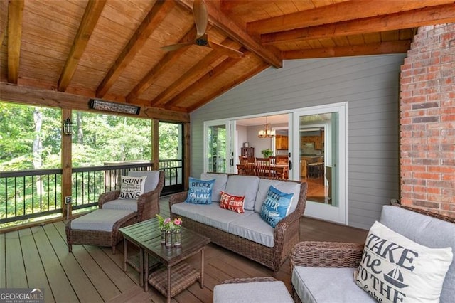 wooden terrace featuring ceiling fan and outdoor lounge area