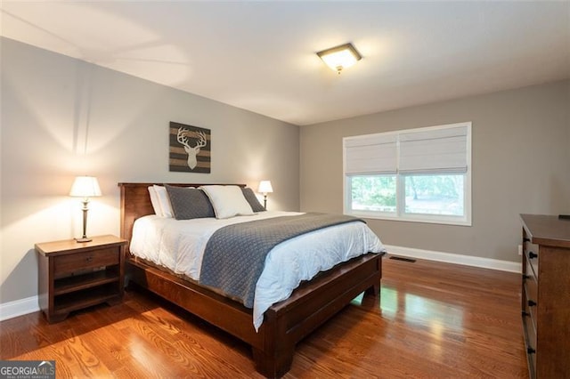 bedroom featuring wood-type flooring