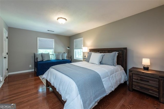 bedroom featuring dark hardwood / wood-style flooring