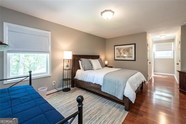 bedroom with wood-type flooring