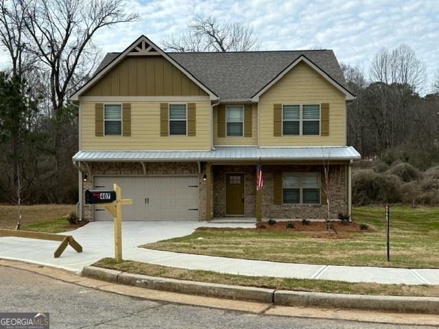 view of front facade featuring a garage and a front lawn