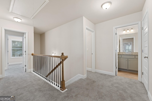 corridor with light colored carpet