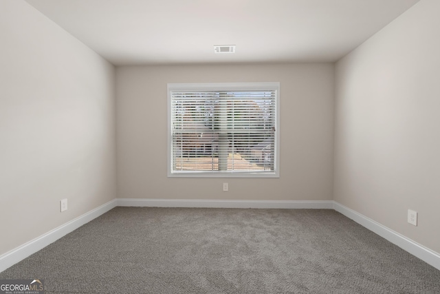 spare room featuring carpet