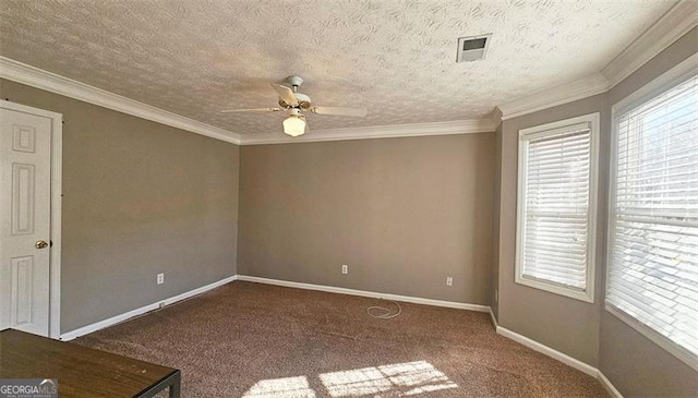 carpeted spare room with crown molding, a wealth of natural light, a textured ceiling, and ceiling fan