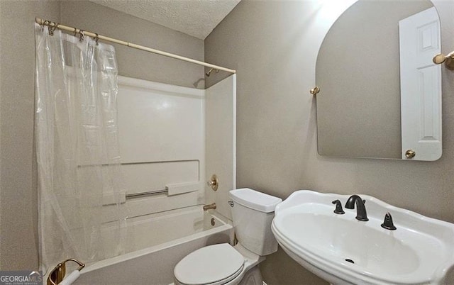 full bathroom with sink, toilet, a textured ceiling, and shower / bath combo with shower curtain