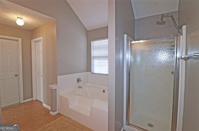 bathroom featuring independent shower and bath and tile patterned flooring