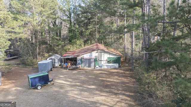 exterior space featuring an outbuilding and a garage