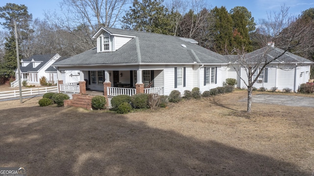 new england style home with a porch