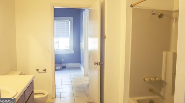 full bathroom featuring vanity, tile patterned flooring,  shower combination, and toilet