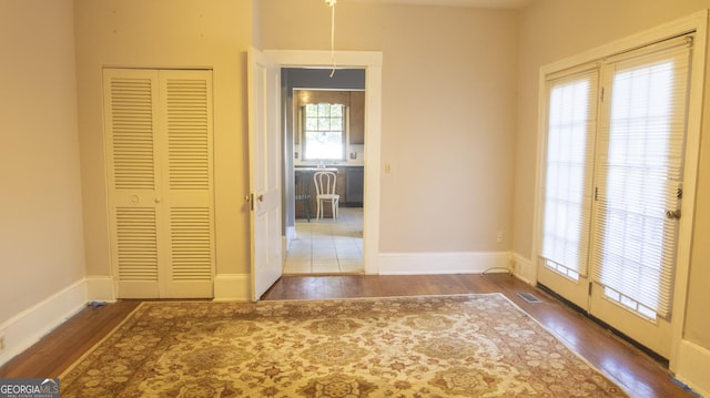 interior space with dark hardwood / wood-style flooring