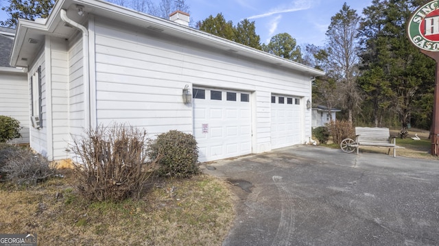 view of side of property with a garage