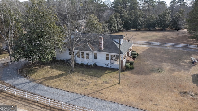 birds eye view of property with a rural view