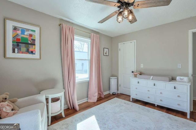 bedroom featuring hardwood / wood-style floors and ceiling fan