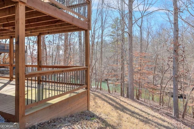 wooden terrace featuring a water view