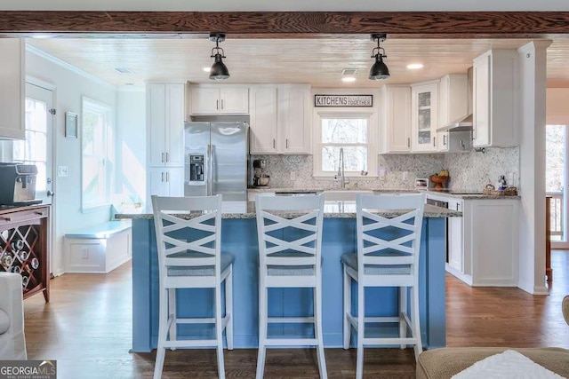 kitchen with decorative light fixtures and white cabinets